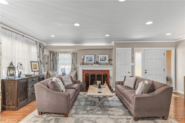536 W Palm Dr, Arcadia, CA 91007 - living area with ornamental molding, wood finished floors, recessed lighting, and a brick fireplace