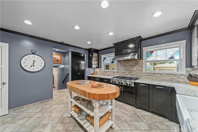 536 W Palm Dr, Arcadia, CA 91007 - kitchen with crown molding, under cabinet range hood, decorative backsplash, recessed lighting, and stainless steel gas cooktop