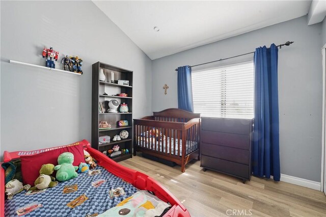 140 W 220th St Unit 105, Carson, CA 90745 - bedroom with wood finished floors, lofted ceiling, and baseboards