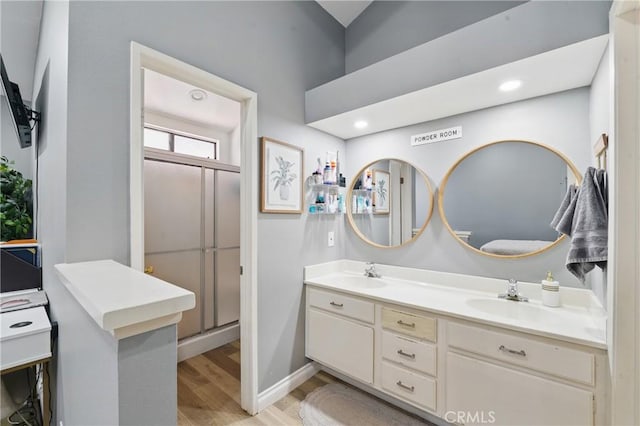 140 W 220th St Unit 105, Carson, CA 90745 - full bath with wood finished floors, double vanity, an enclosed shower, and recessed lighting
