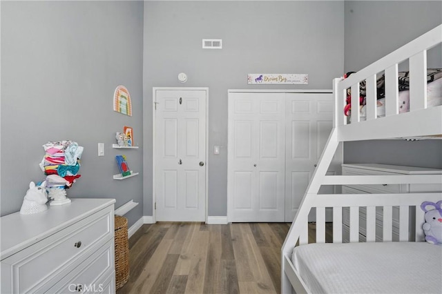 140 W 220th St Unit 105, Carson, CA 90745 - bedroom with wood finished floors, baseboards, and a closet