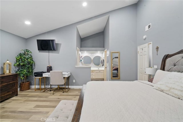 140 W 220th St Unit 105, Carson, CA 90745 - bedroom with wood finished floors, baseboards, a desk, recessed lighting, and ensuite bath
