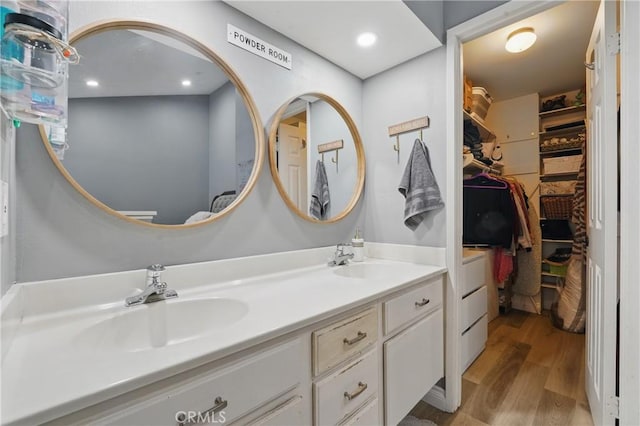 140 W 220th St Unit 105, Carson, CA 90745 - full bath featuring wood finished floors, double vanity, and a walk in closet