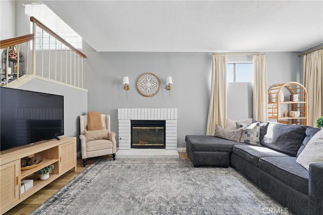 140 W 220th St Unit 105, Carson, CA 90745 - living area featuring a fireplace and wood finished floors