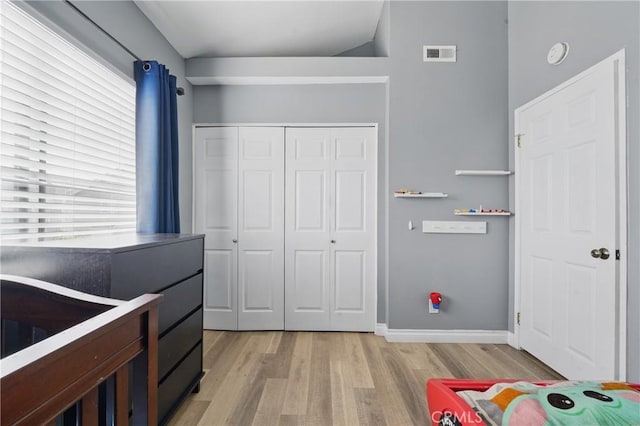 140 W 220th St Unit 105, Carson, CA 90745 - bedroom with light wood-style flooring, a closet, and baseboards