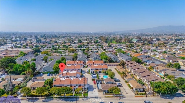 140 W 220th St Unit 105, Carson, CA 90745 - aerial view of property and surrounding area with nearby suburban area and a mountain backdrop