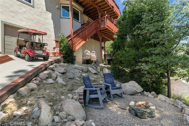 781 Brentwood Dr, Lake Arrowhead, CA 92352 - view of patio / terrace with a fire pit, stairs, and a wooden deck