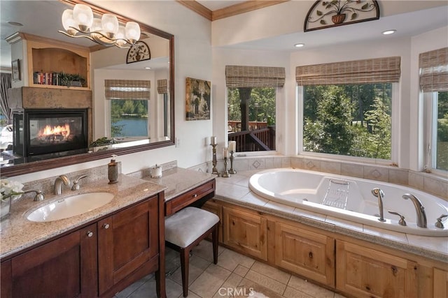 781 Brentwood Dr, Lake Arrowhead, CA 92352 - full bath featuring tile patterned flooring, a tub with jets, a fireplace, vanity, and ornamental molding