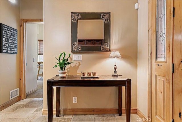 781 Brentwood Dr, Lake Arrowhead, CA 92352 - hallway with light stone finish floors and baseboards