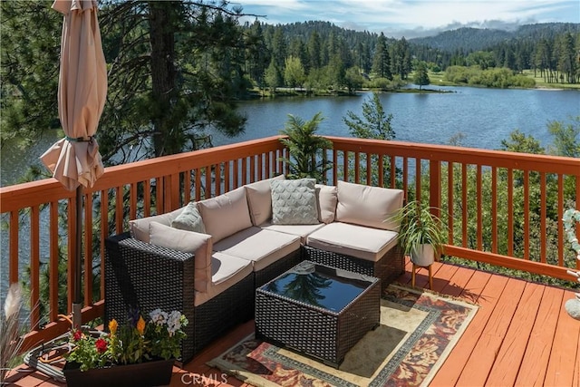 781 Brentwood Dr, Lake Arrowhead, CA 92352 - wooden deck featuring a view of trees, a water view, and an outdoor hangout area