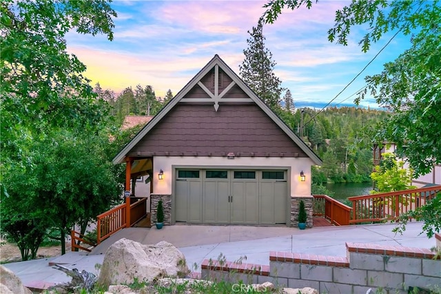 781 Brentwood Dr, Lake Arrowhead, CA 92352 - garage at dusk featuring a water view