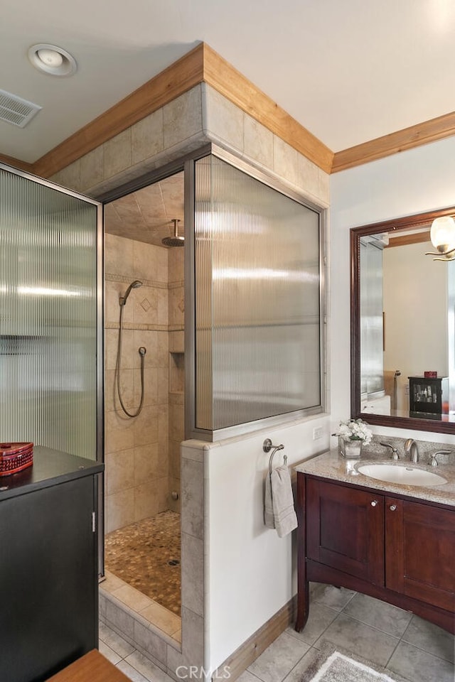 781 Brentwood Dr, Lake Arrowhead, CA 92352 - full bathroom with a tile shower, vanity, tile patterned floors, and ornamental molding