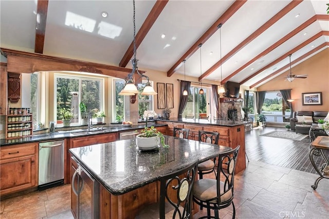 781 Brentwood Dr, Lake Arrowhead, CA 92352 - kitchen featuring brown cabinetry, beamed ceiling, a kitchen island, recessed lighting, and open floor plan