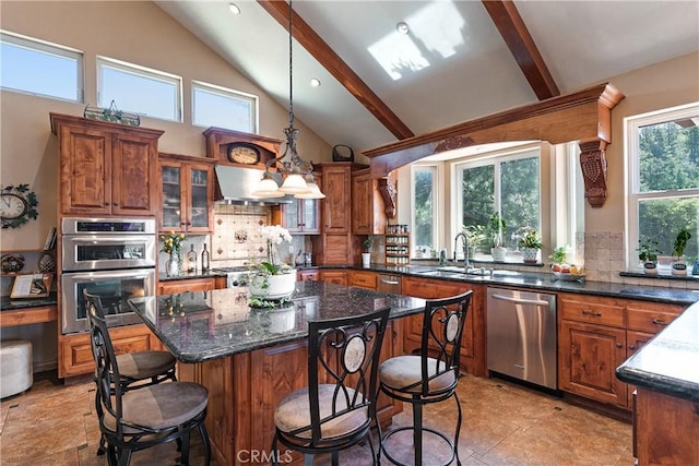 781 Brentwood Dr, Lake Arrowhead, CA 92352 - kitchen with appliances with stainless steel finishes, a breakfast bar, decorative backsplash, brown cabinetry, and high vaulted ceiling