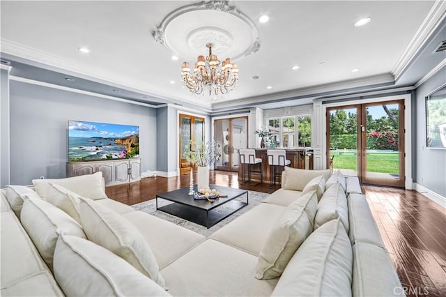 443 W Longden Ave, Arcadia, CA 91007 - living room with baseboards, ornamental molding, a chandelier, wood finished floors, and plenty of natural light