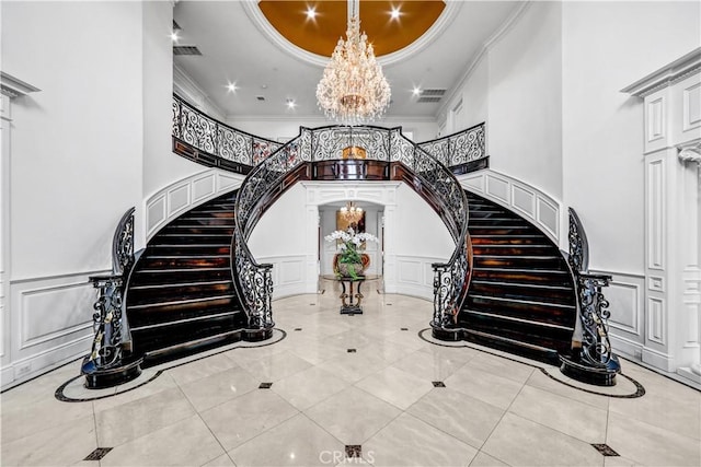 443 W Longden Ave, Arcadia, CA 91007 - tiled foyer entrance featuring a decorative wall, stairway, ornamental molding, a chandelier, and a tray ceiling