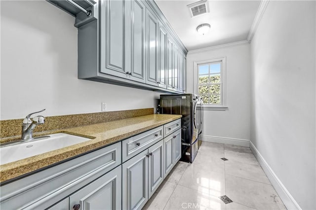 443 W Longden Ave, Arcadia, CA 91007 - laundry room with washer and dryer, cabinet space, ornamental molding, baseboards, and light tile patterned floors