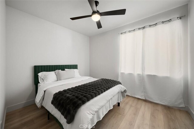 1941 Devaul Ranch Dr, San Luis Obispo, CA 93405 - bedroom with wood finished floors, baseboards, and a ceiling fan