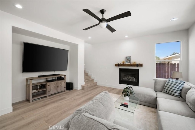 1941 Devaul Ranch Dr, San Luis Obispo, CA 93405 - living room featuring a ceiling fan, wood finished floors, a glass covered fireplace, recessed lighting, and stairway