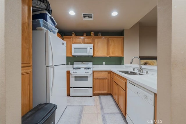 13200 Pacific Promenade Unit 217, Playa Vista, CA 90094 - kitchen featuring white appliances, a sink, light countertops, recessed lighting, and light tile patterned floors