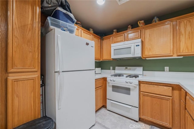 13200 Pacific Promenade Unit 217, Playa Vista, CA 90094 - kitchen featuring white appliances, light countertops, and light tile patterned flooring