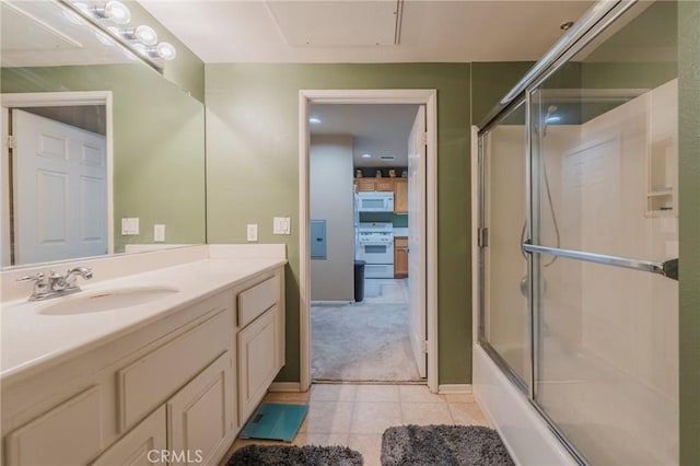 13200 Pacific Promenade Unit 217, Playa Vista, CA 90094 - bathroom featuring vanity, tile patterned floors, and combined bath / shower with glass door