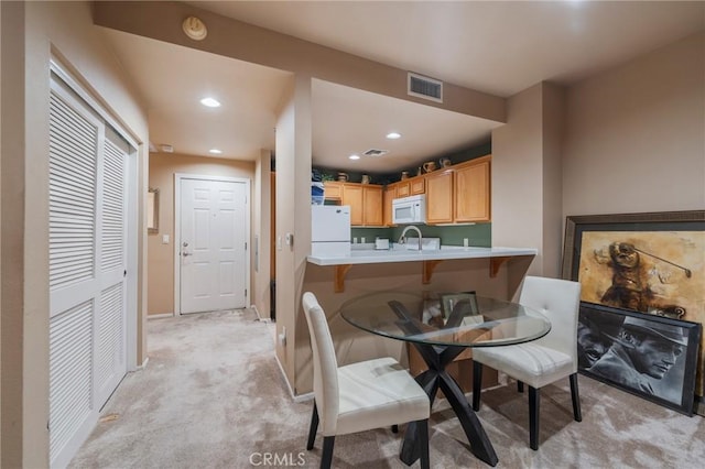 13200 Pacific Promenade Unit 217, Playa Vista, CA 90094 - dining room featuring light carpet, recessed lighting, and baseboards