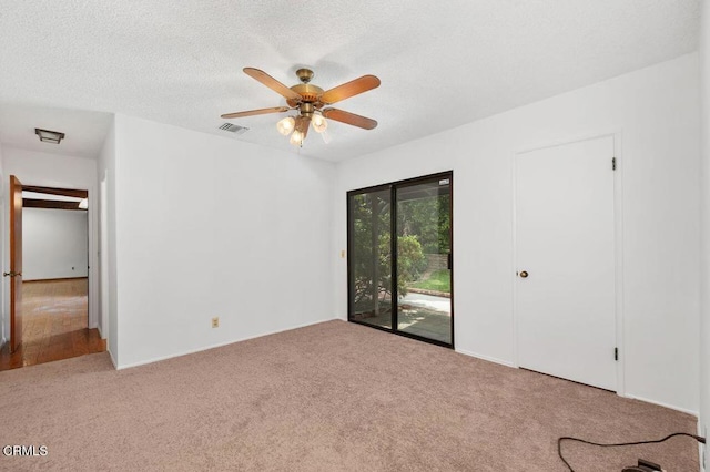 1139 Fairview Dr, La Canada Flintridge, CA 91011 - unfurnished bedroom featuring access to outside, carpet floors, a ceiling fan, and a textured ceiling
