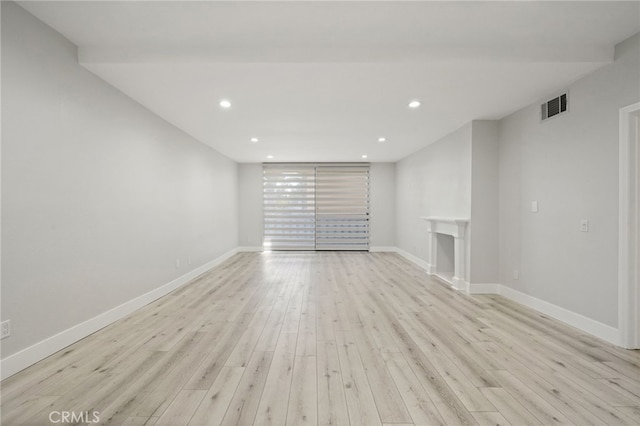 19029 Nordhoff St Unit 103, Northridge, CA 91324 - unfurnished living room featuring light wood finished floors, baseboards, and recessed lighting