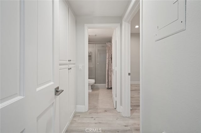 19029 Nordhoff St Unit 103, Northridge, CA 91324 - hallway with light wood-type flooring and baseboards