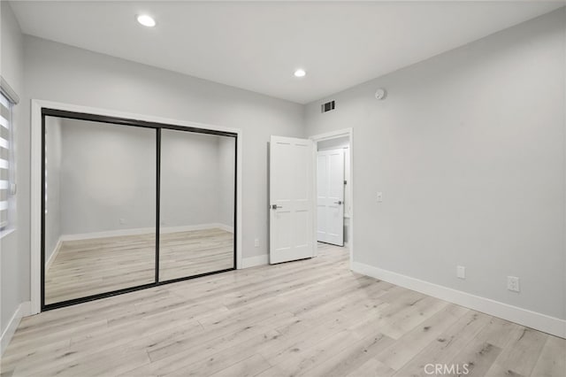 19029 Nordhoff St Unit 103, Northridge, CA 91324 - unfurnished bedroom featuring light wood-type flooring, a closet, baseboards, and recessed lighting