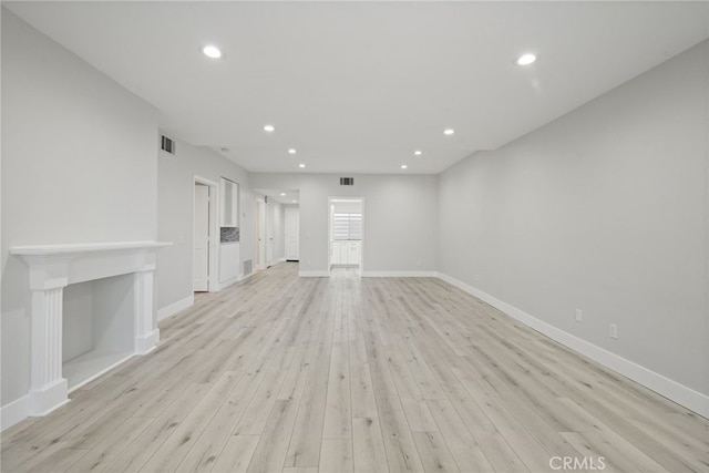 19029 Nordhoff St Unit 103, Northridge, CA 91324 - unfurnished living room featuring light wood-style floors, recessed lighting, and baseboards