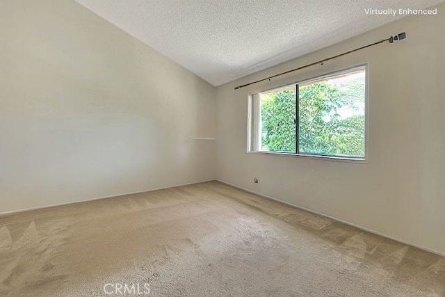 6237 Birdie Dr, La Verne, CA 91750 - spare room with carpet floors, a textured ceiling, vaulted ceiling, and baseboards