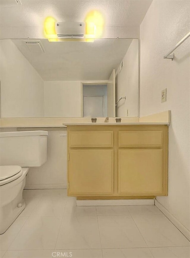 6237 Birdie Dr, La Verne, CA 91750 - bathroom featuring toilet, vanity, and baseboards