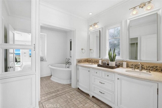 111 Brooks, Laguna Beach, CA 92651 - full bath with double vanity, a freestanding bath, ornamental molding, and brick patterned flooring