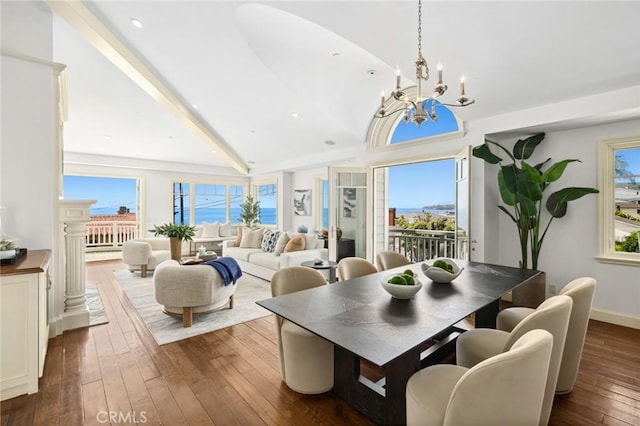 111 Brooks, Laguna Beach, CA 92651 - dining area with a chandelier, lofted ceiling, dark wood-style floors, and recessed lighting