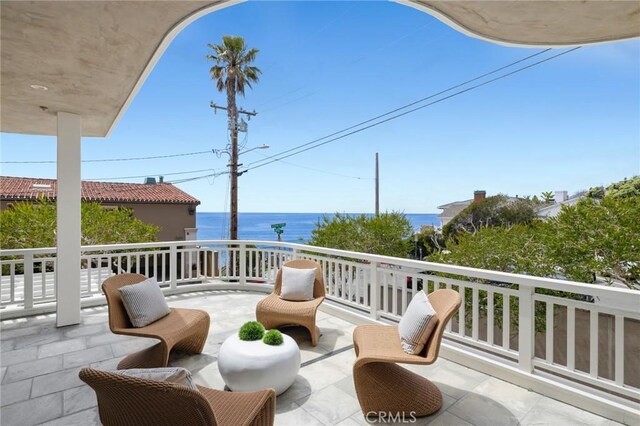 111 Brooks, Laguna Beach, CA 92651 - view of patio / terrace with a balcony and a water view