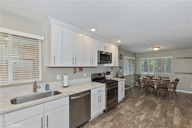 381 Santa Clara Blvd, Big Bear Lake, CA 92315 - kitchen with stainless steel appliances, a sink, dark wood-style floors, white cabinetry, and recessed lighting