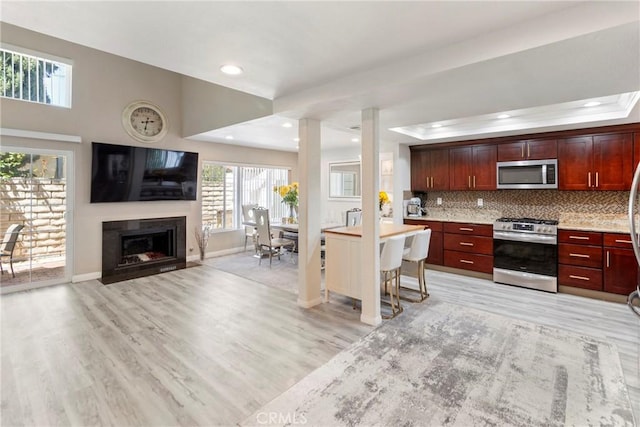 20645 Roscoe Blvd Unit G, Winnetka, CA 91306 - kitchen with appliances with stainless steel finishes, light wood-style floors, light countertops, plenty of natural light, and recessed lighting