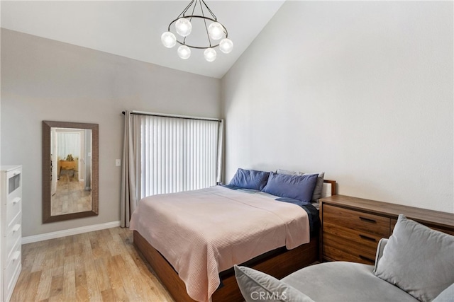 20645 Roscoe Blvd Unit G, Winnetka, CA 91306 - bedroom with a chandelier, light wood-style flooring, high vaulted ceiling, and baseboards