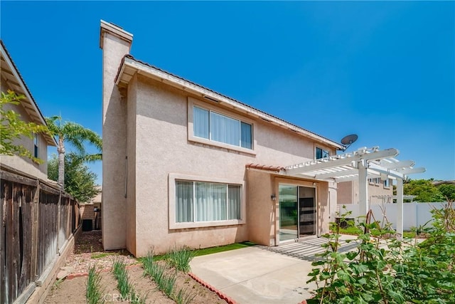7358 Freedom Pl, Rancho Cucamonga, CA 91730 - back of property with stucco siding, a pergola, a patio area, a fenced backyard, and a chimney