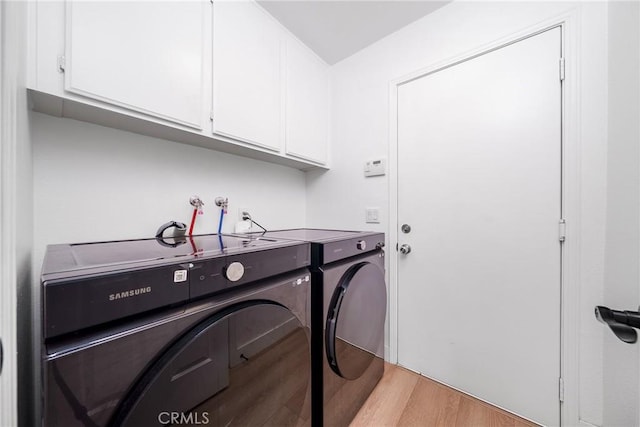 7358 Freedom Pl, Rancho Cucamonga, CA 91730 - laundry room featuring washer and clothes dryer, cabinet space, and light wood-style floors