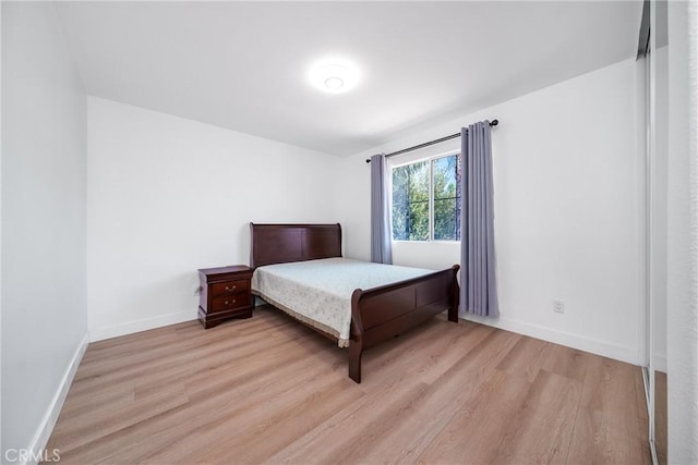 7358 Freedom Pl, Rancho Cucamonga, CA 91730 - bedroom with light wood-style flooring and baseboards