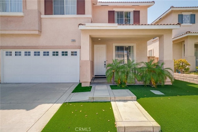 7358 Freedom Pl, Rancho Cucamonga, CA 91730 - view of front of property featuring stucco siding, an attached garage, and driveway