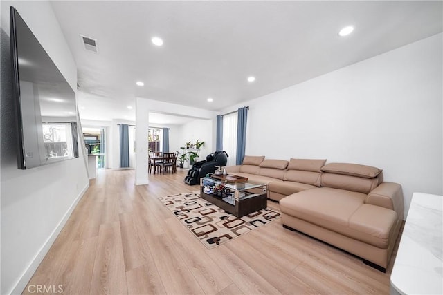 7358 Freedom Pl, Rancho Cucamonga, CA 91730 - living room featuring light wood finished floors, healthy amount of natural light, recessed lighting, and baseboards