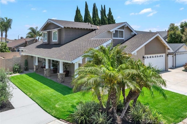 14652 Danborough Rd, Tustin, CA 92780 - view of front of house with a porch, stucco siding, driveway, an attached garage, and a front lawn