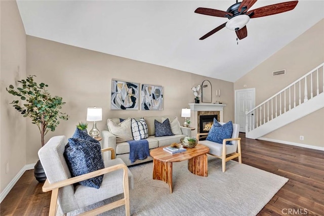 14652 Danborough Rd, Tustin, CA 92780 - living room with ceiling fan, wood finished floors, stairway, high vaulted ceiling, and a glass covered fireplace