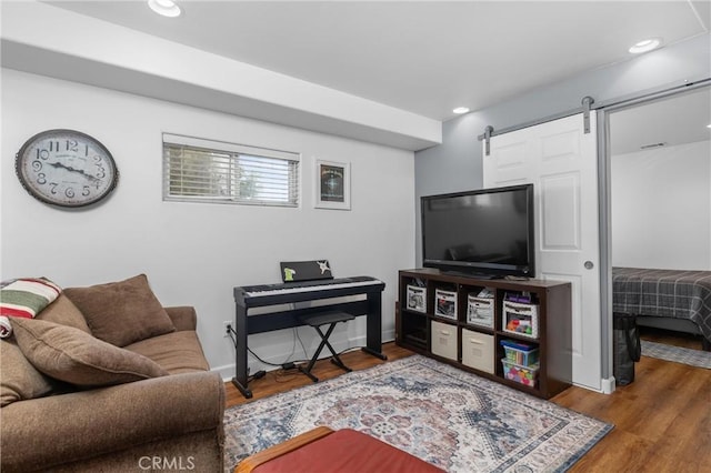 448 Radcliff St, Morro Bay, CA 93442 - living room with a barn door, wood finished floors, baseboards, and recessed lighting