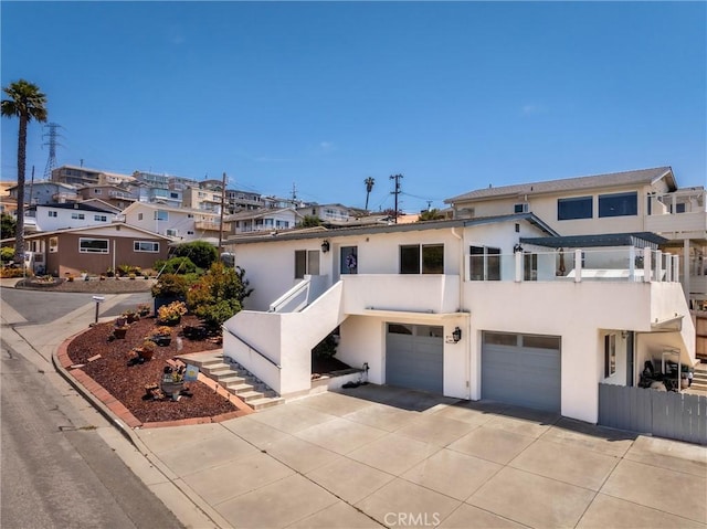 448 Radcliff St, Morro Bay, CA 93442 - multi unit property with stairway, stucco siding, concrete driveway, an attached garage, and a residential view