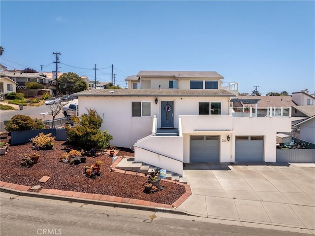 448 Radcliff St, Morro Bay, CA 93442 - view of front of property with stucco siding, driveway, and an attached garage